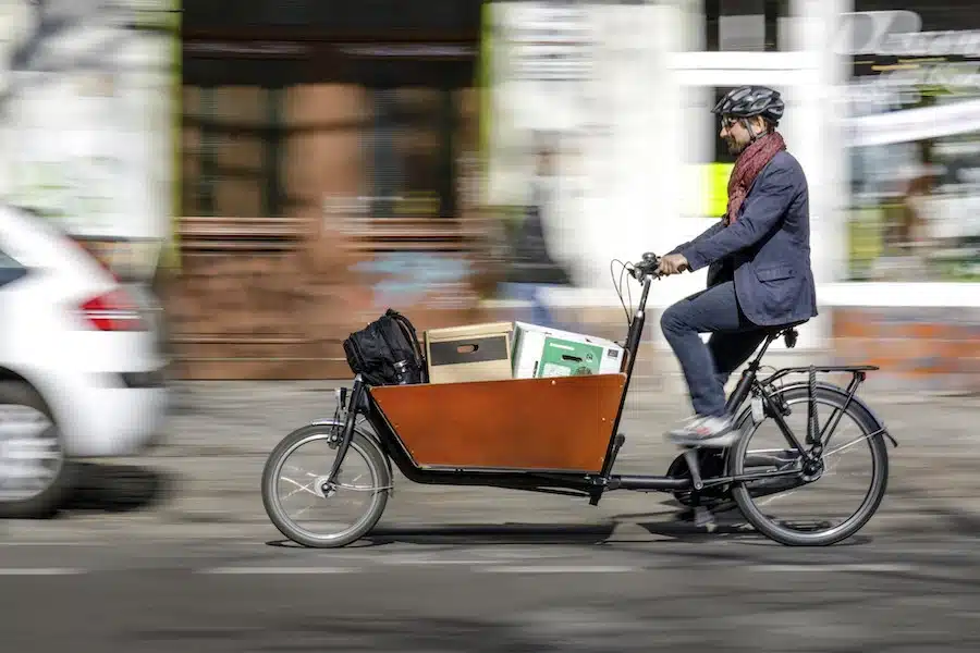 UK cargo bikes parcel delivery on a box bike in wood