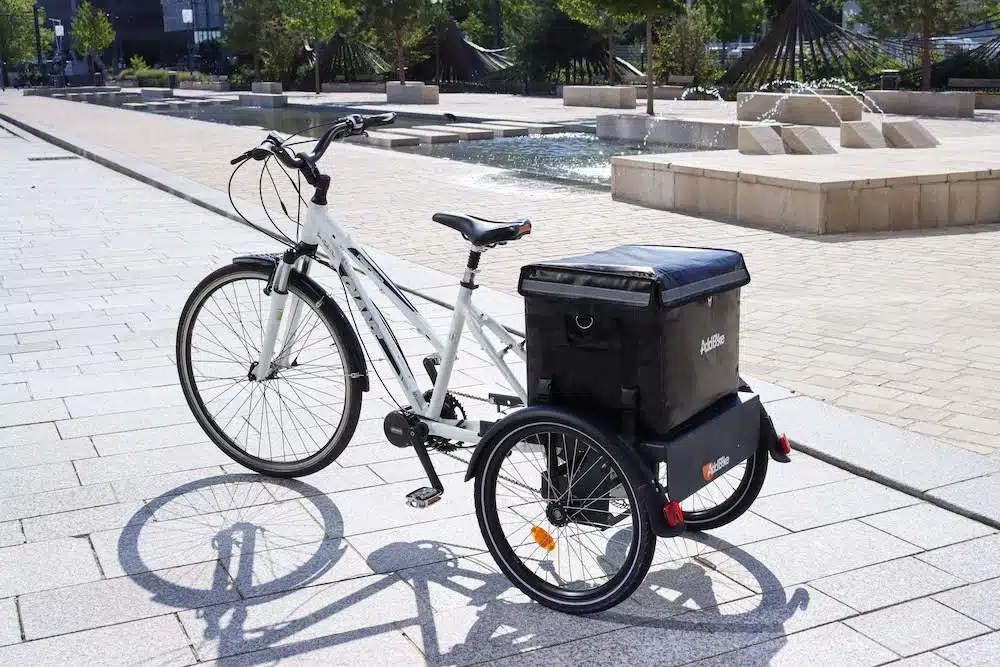 UK cargo bikes: tricycle B-Back in a sunny city landscape